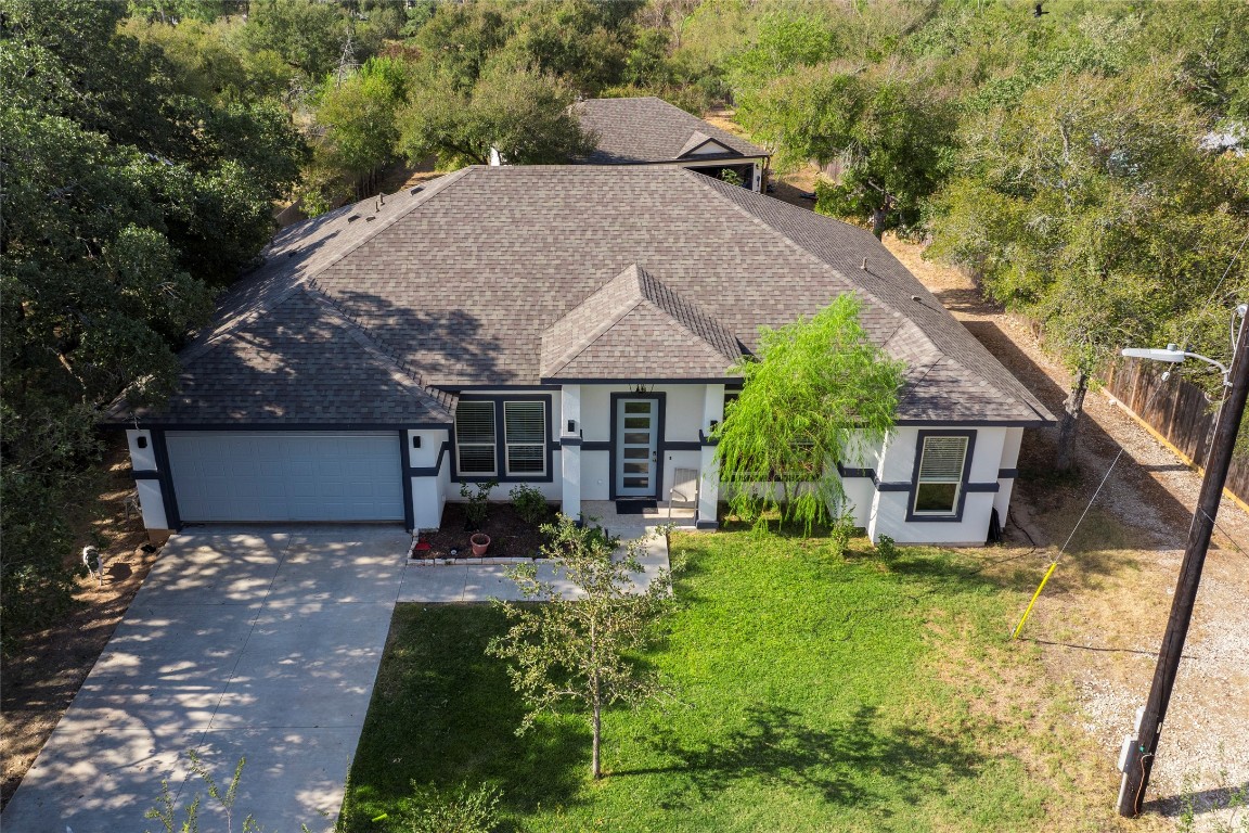 a view of house with yard and entertaining space