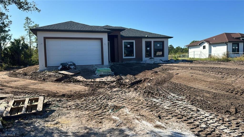 View of front of property with a garage