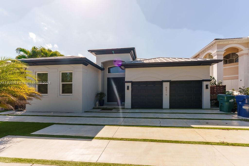 a front view of a house with a garage