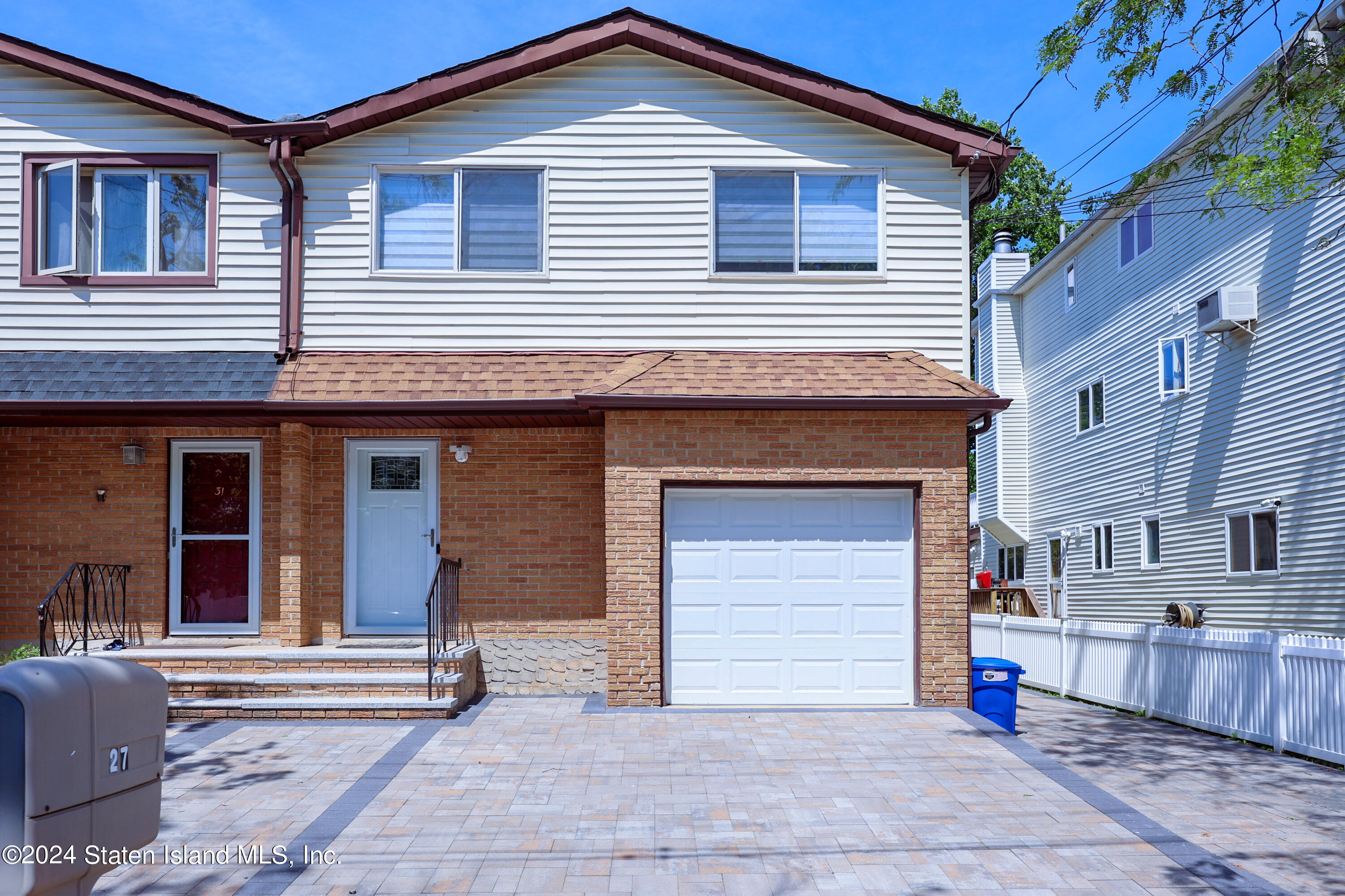 a front view of a house with a garage