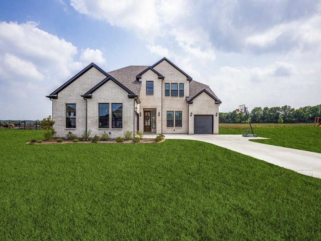 a view of a house and a yard with green space