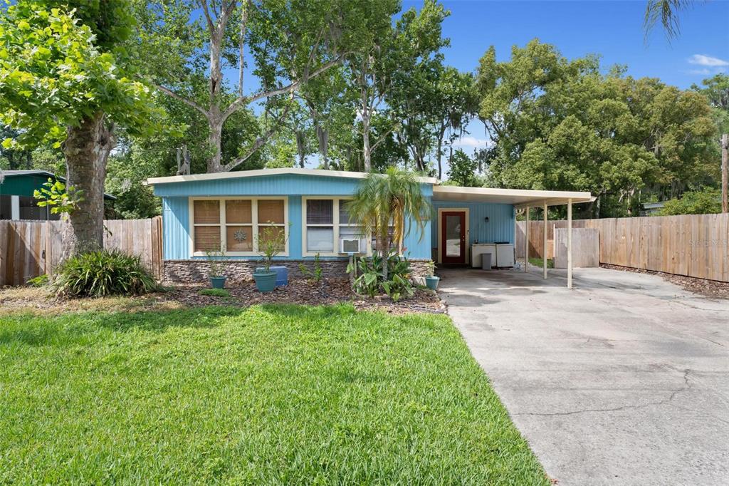 front view of a house with a yard