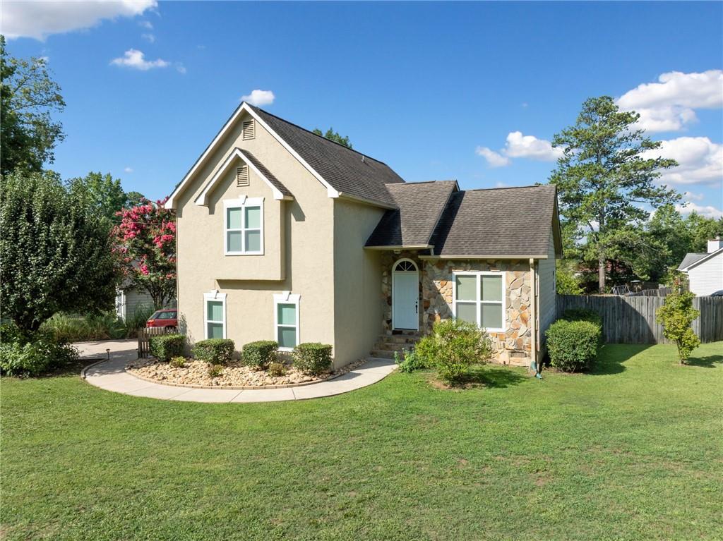 a front view of a house with a yard