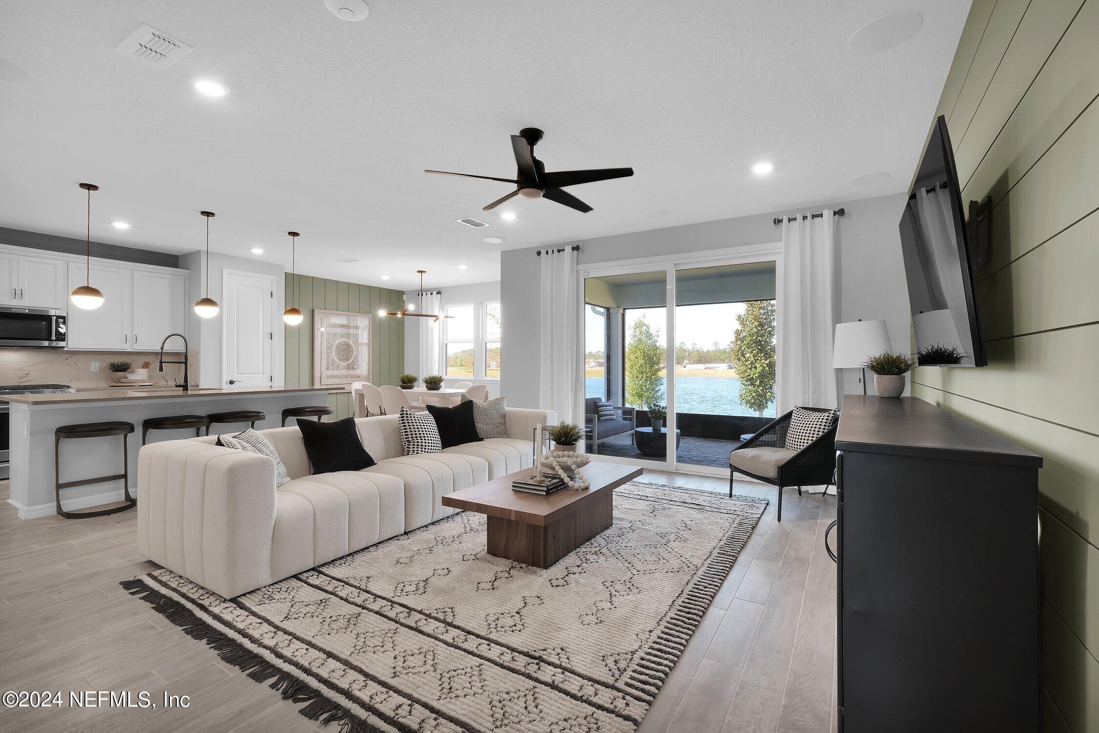 a living room with fireplace furniture and a flat screen tv