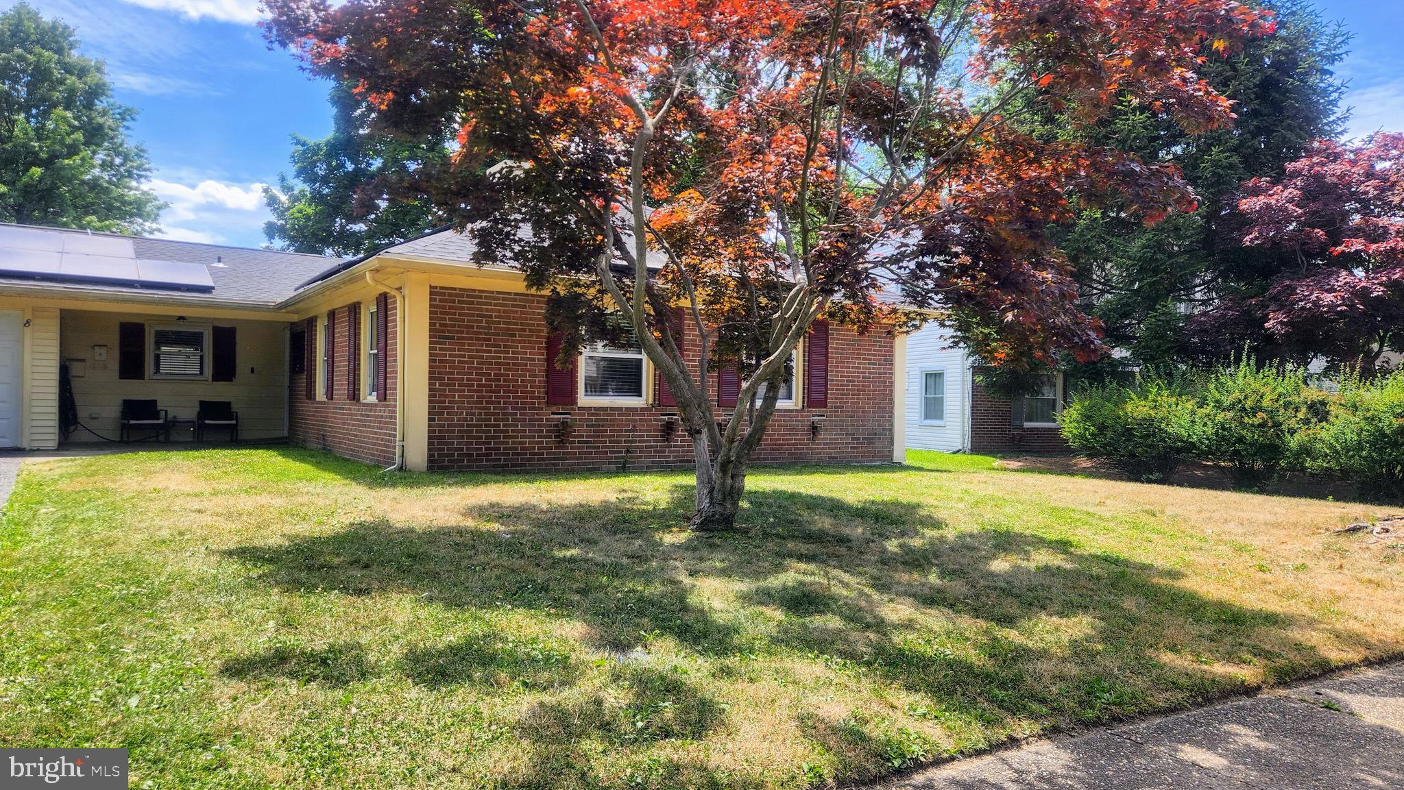 a house with trees in front of it