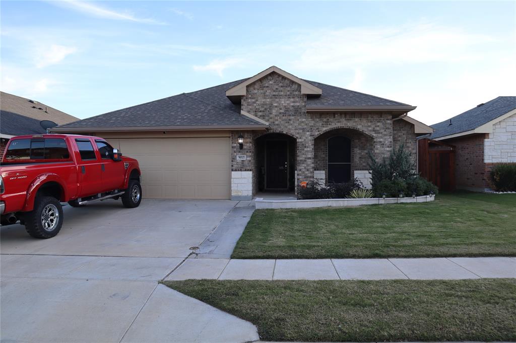 a view of a car parked in front of a house