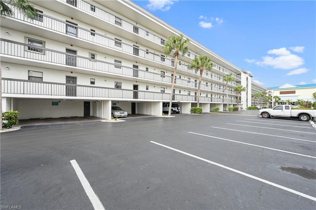 a view of building with parking area