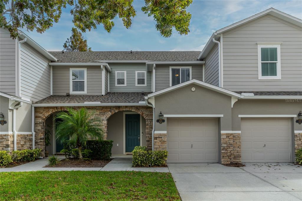 front view of a house with a yard