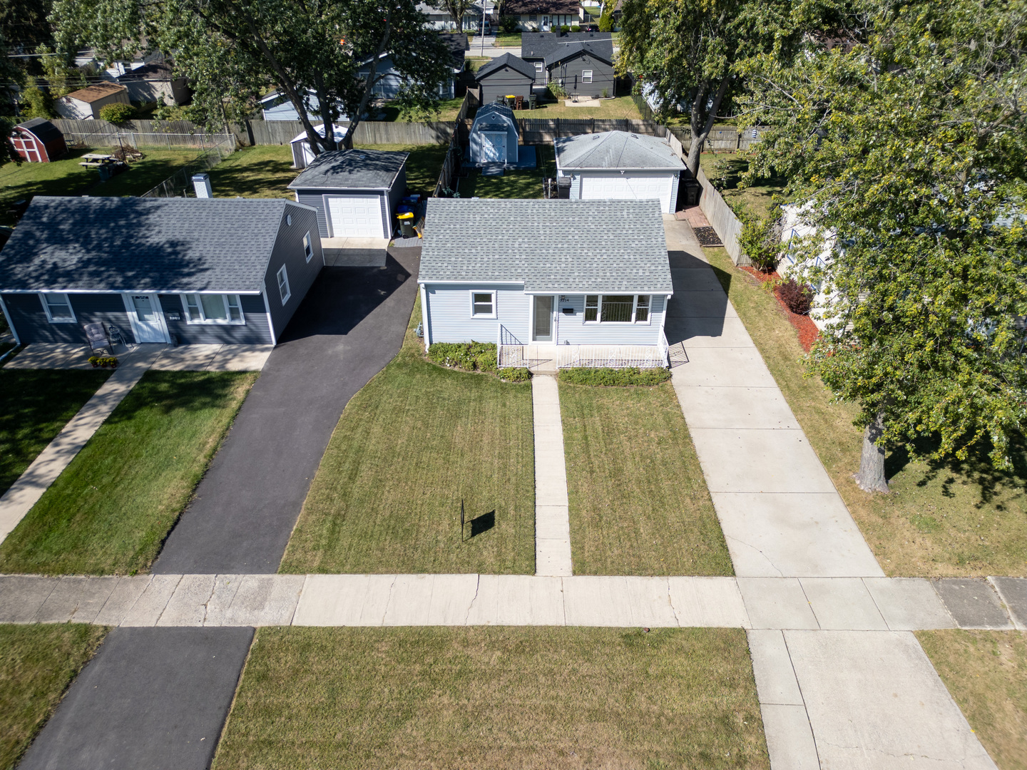 an aerial view of a house with swimming pool