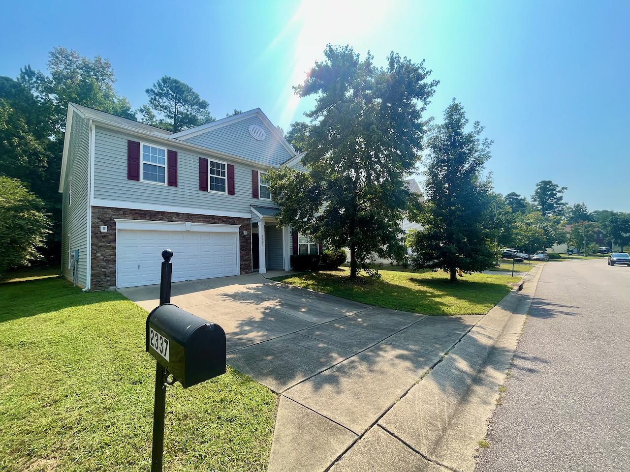 a front view of house with yard and entertaining space