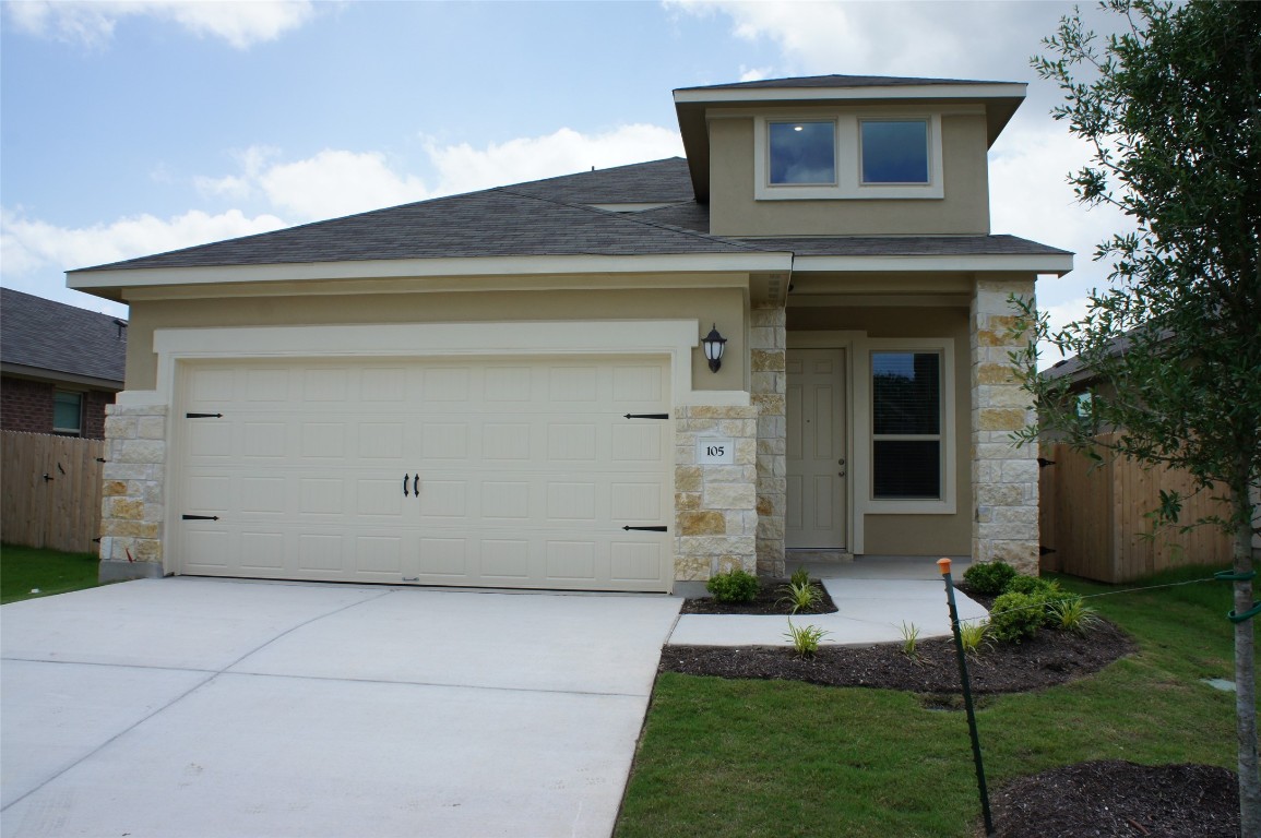 a view of house with yard