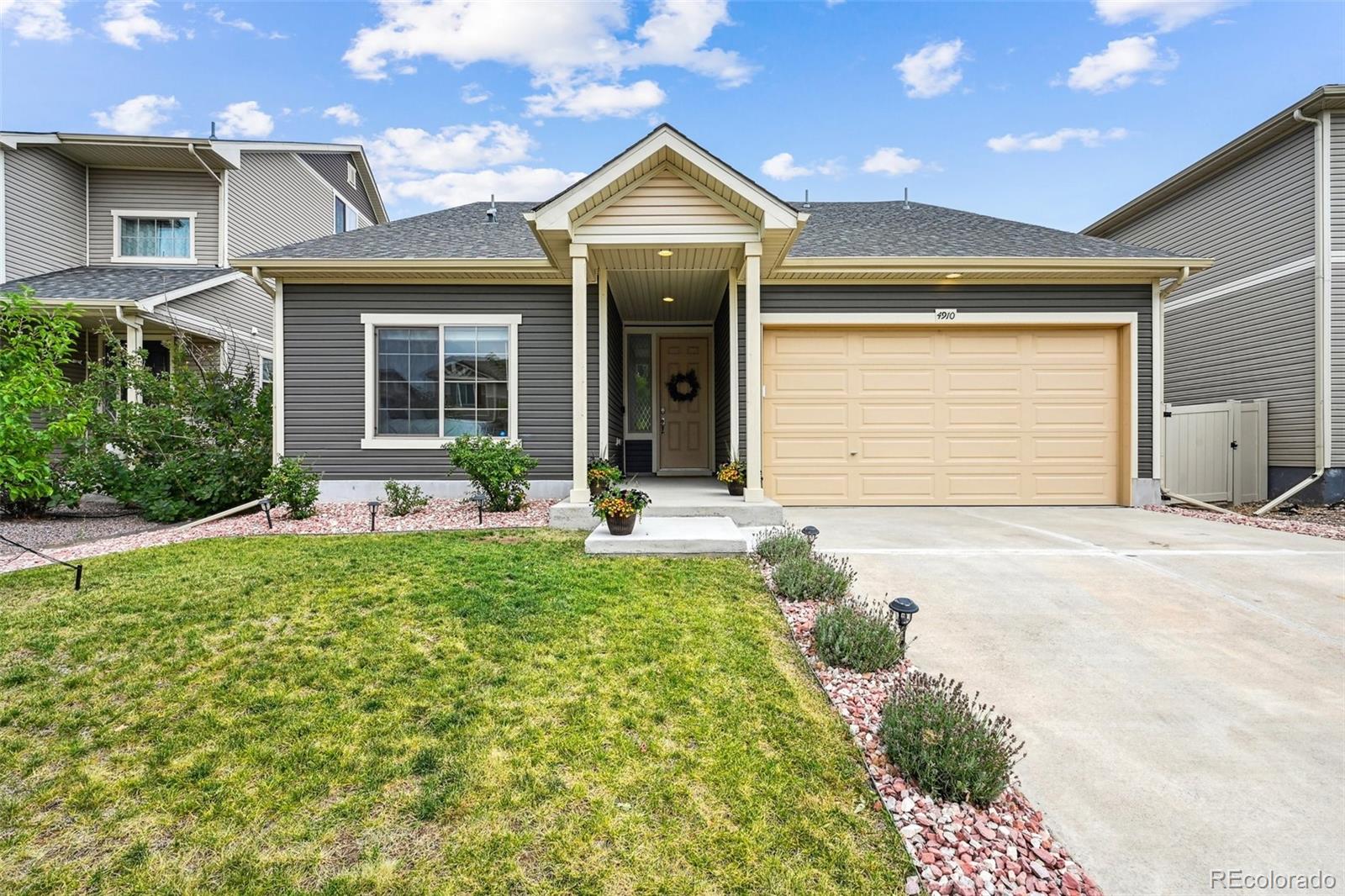 front view of a house with a yard