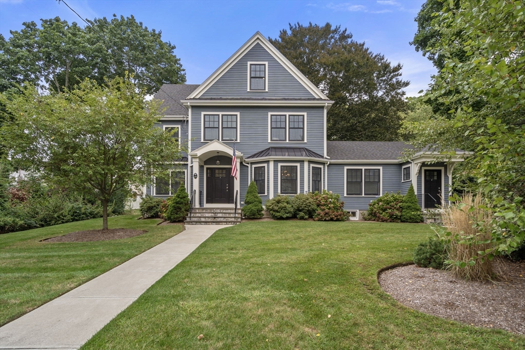 a front view of a house with a yard