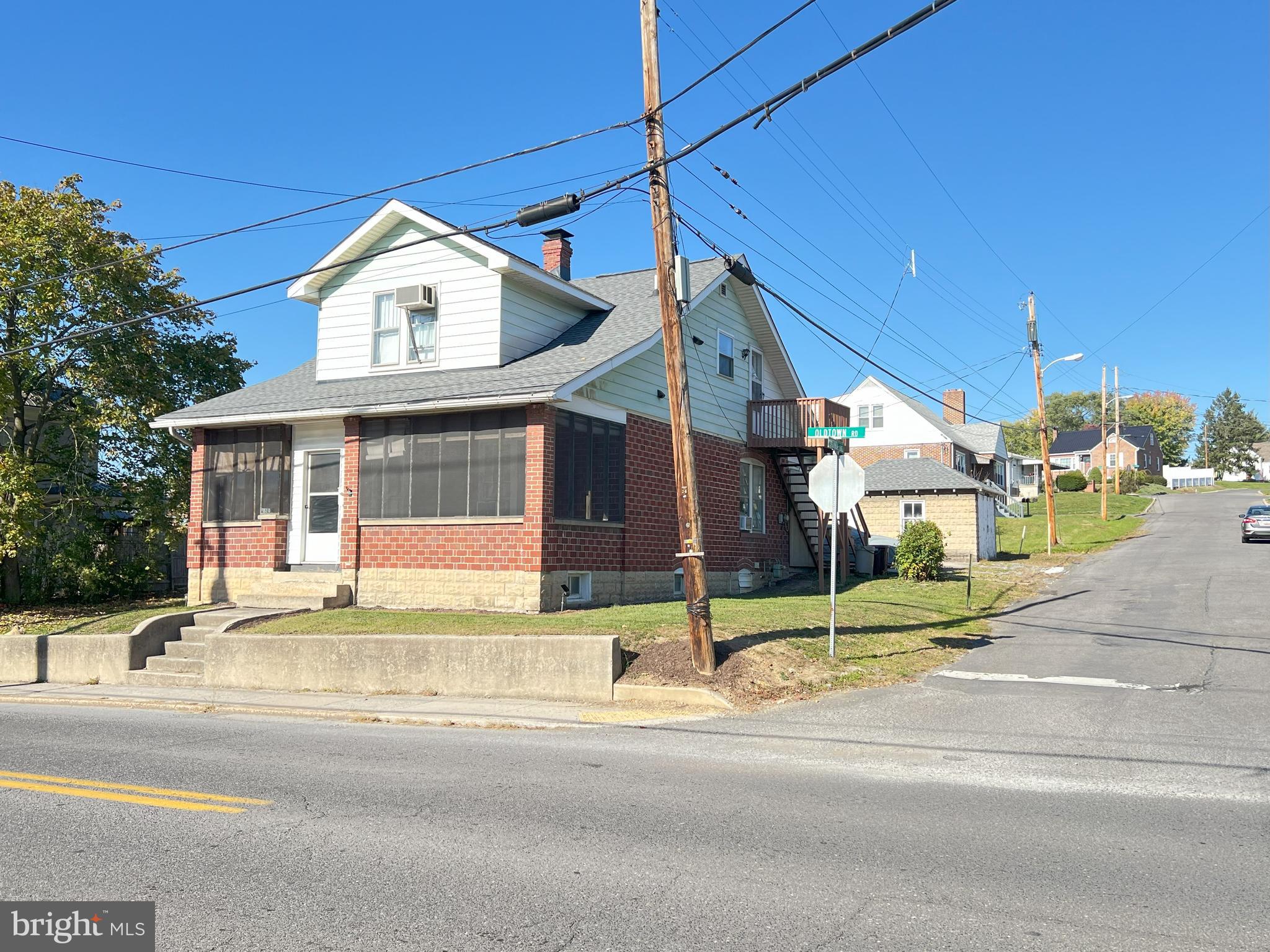 a view of a house with a street