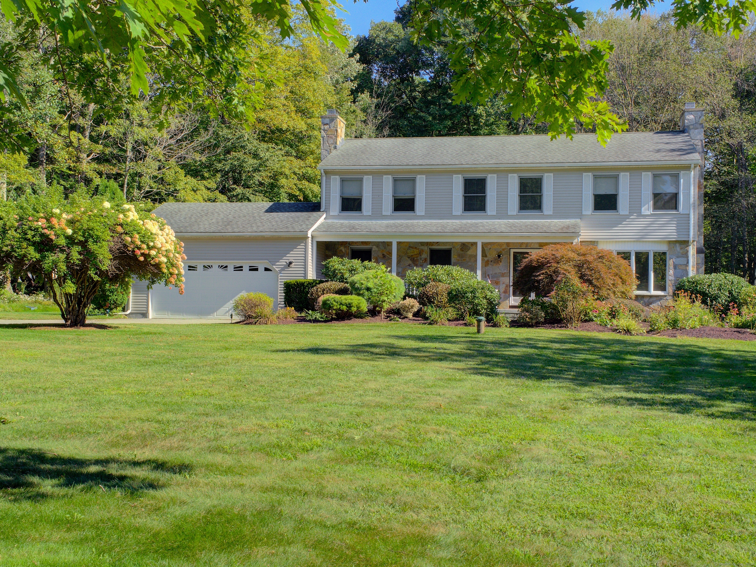 a view of a house with a garden