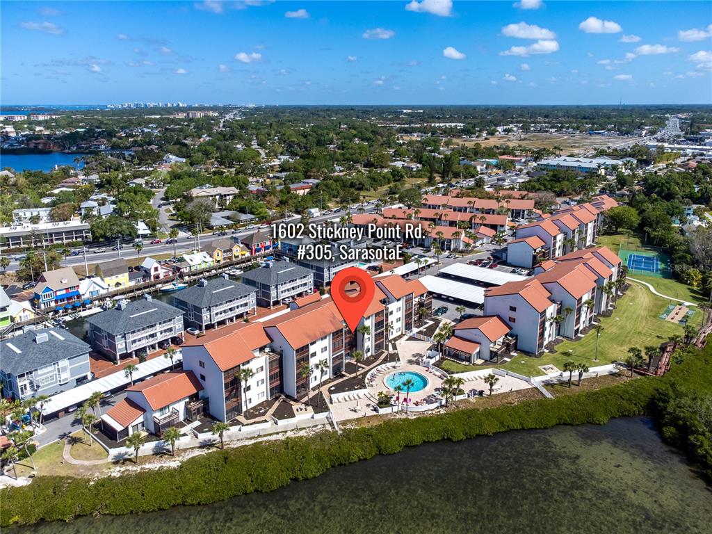 an aerial view of residential houses with outdoor space