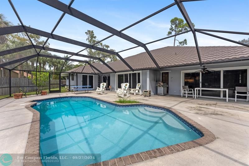 a view of swimming pool with a patio