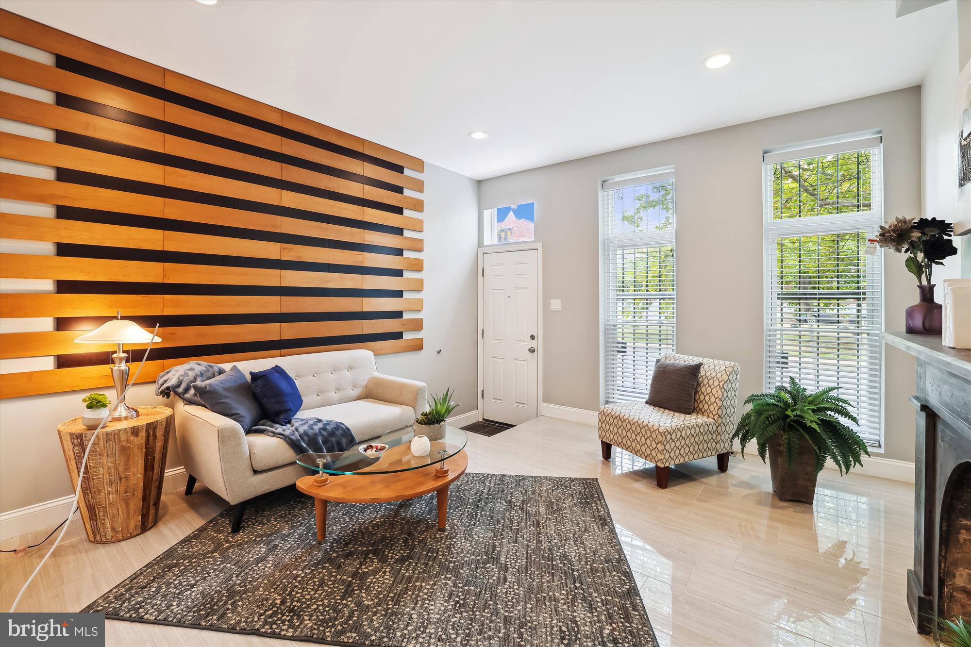 a living room with furniture and a large window