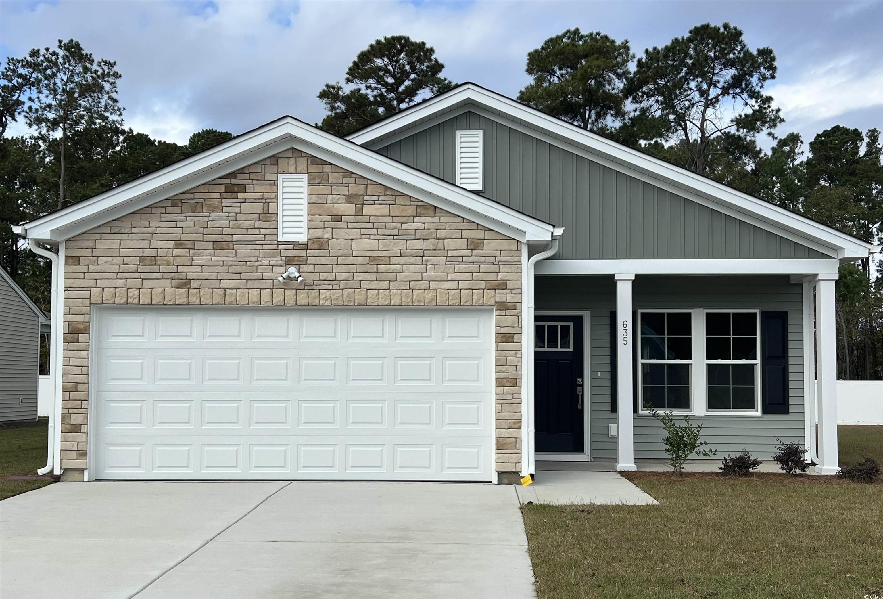 Craftsman-style house featuring a front yard and a