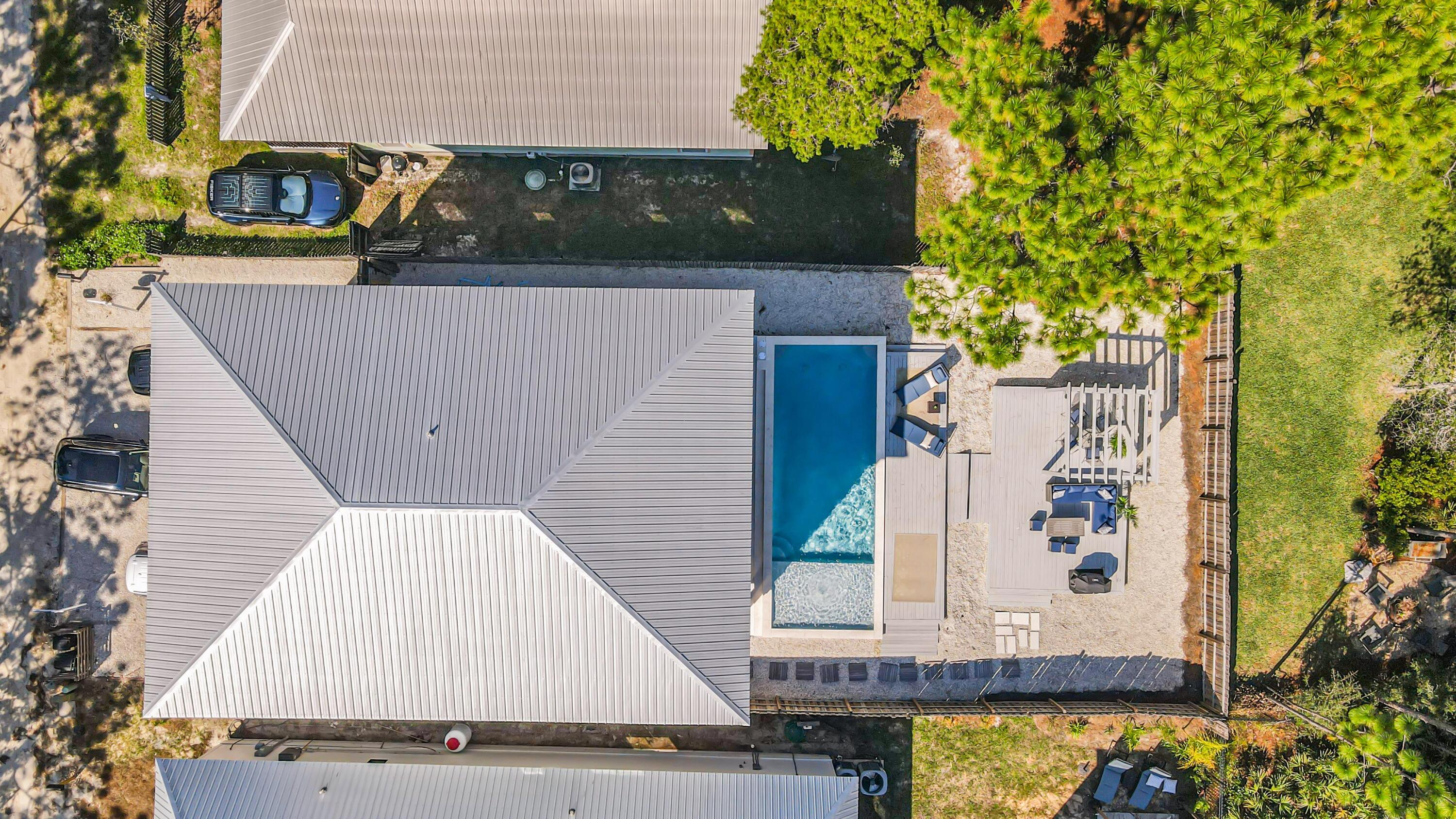 an aerial view of a house with swimming pool