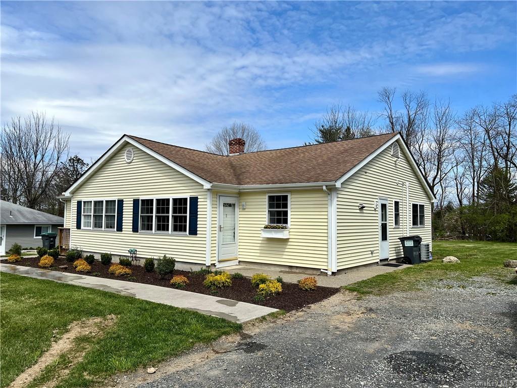 a front view of a house with yard