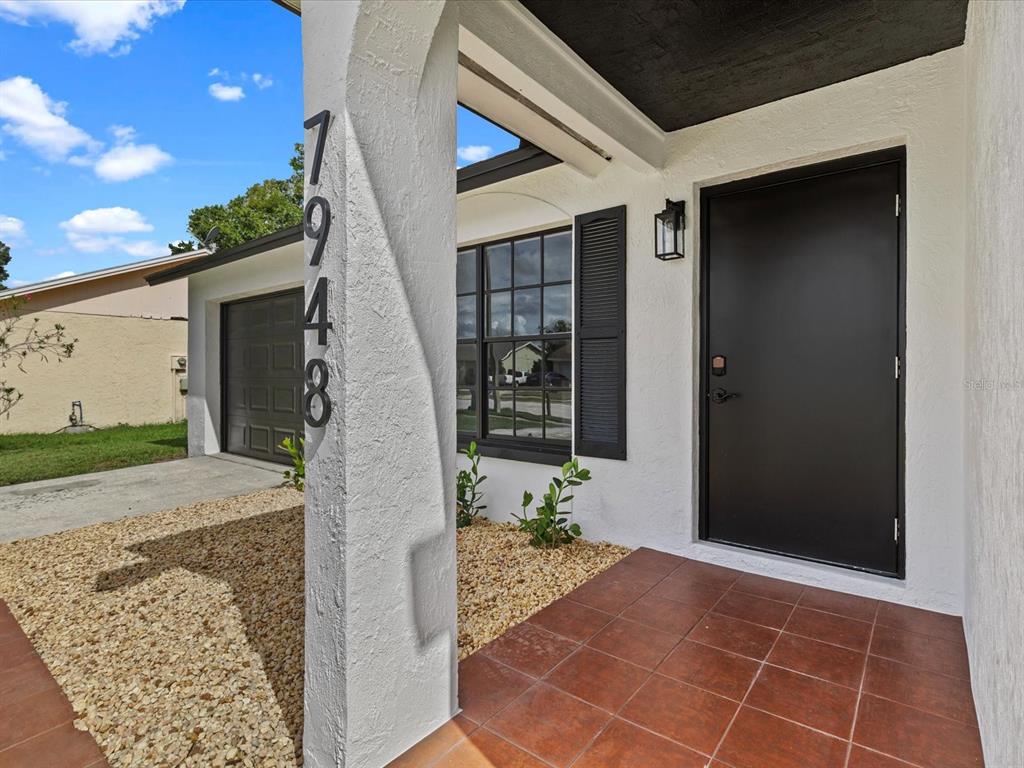 a view of a entryway door front of house