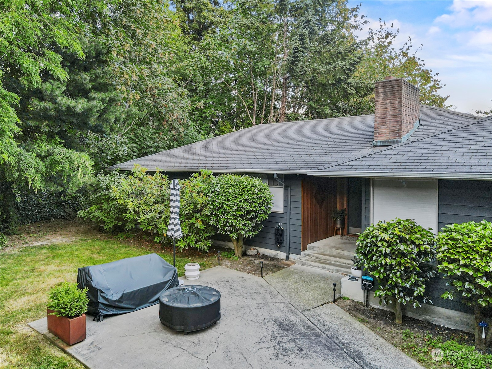 a house view with a garden space