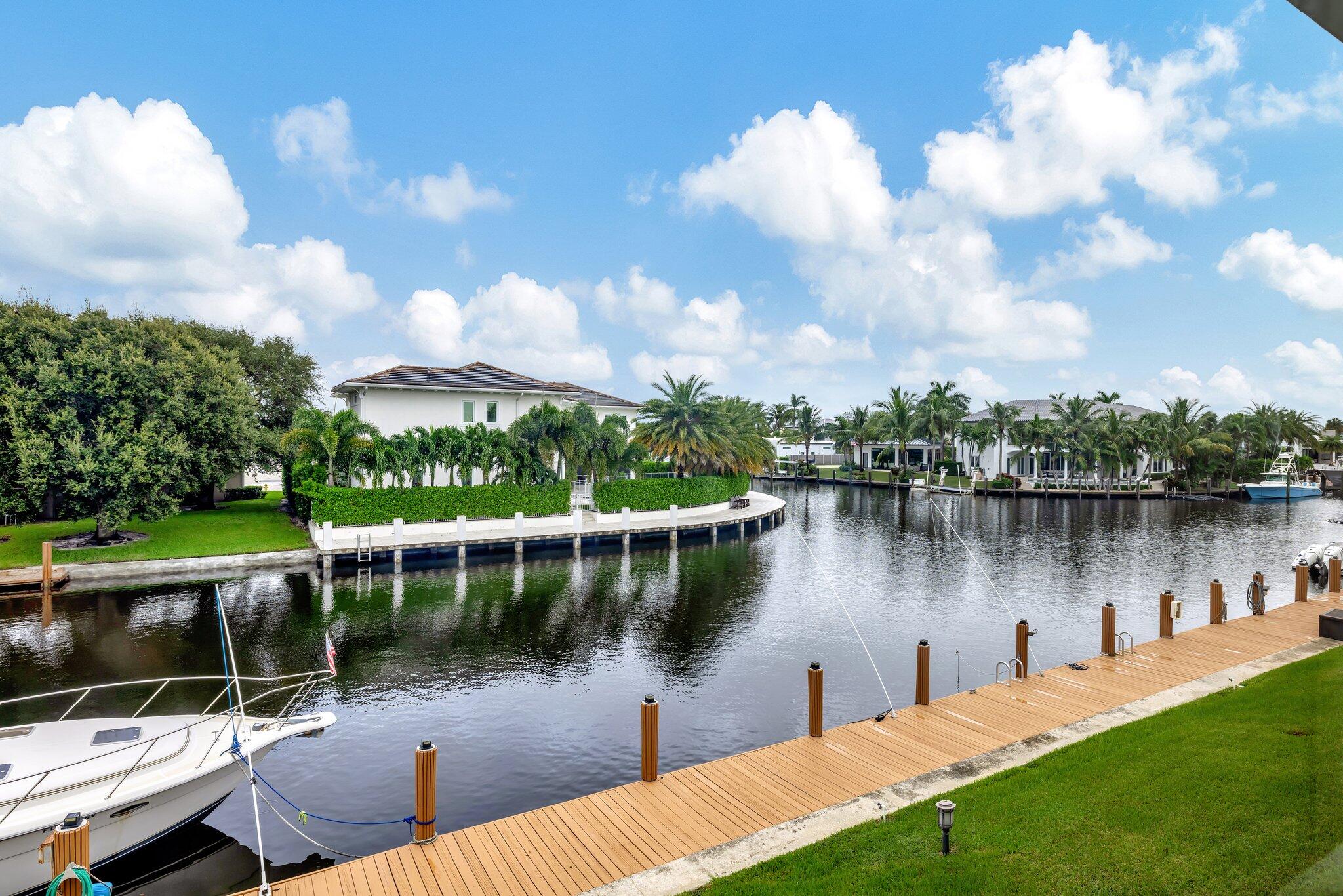 a view of a lake with houses in the back