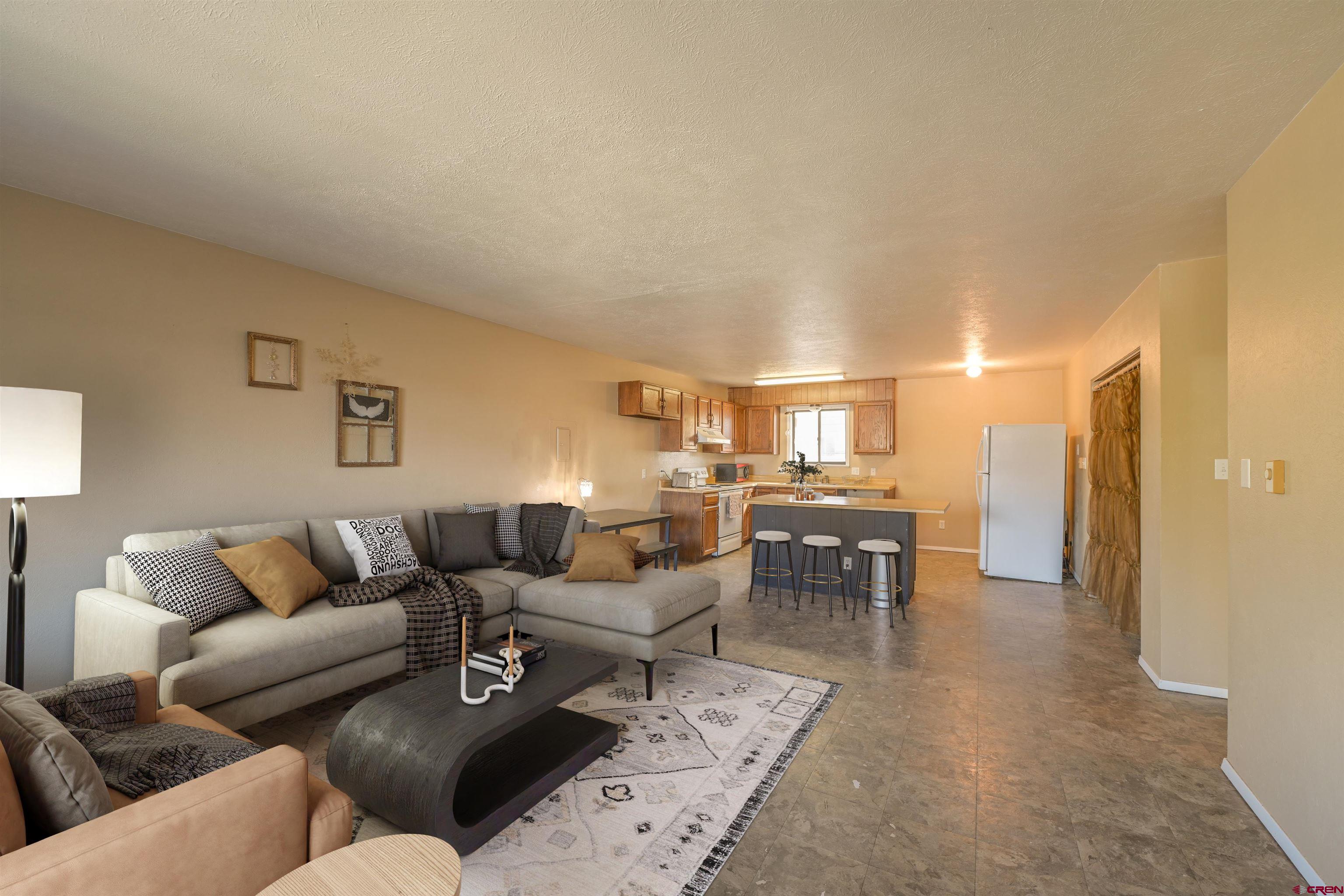 a living room with furniture and a table