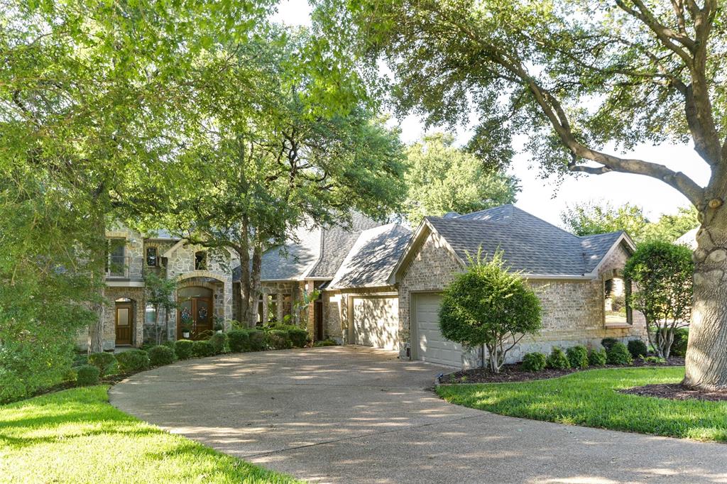 a view of a large trees in front of a house