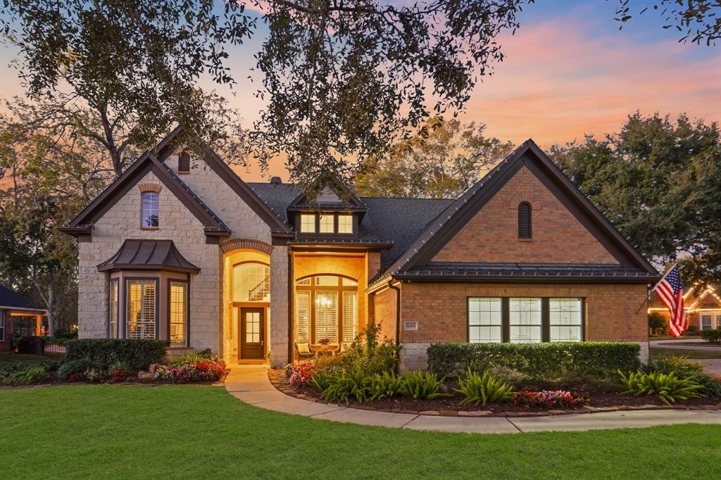 Nestled amongst a canopy of trees, on the highly desirable Oxbow Island section of Weston Lakes, sits this beautiful 2-story home. The mixture of brick and stone, combined with varied roof lines and sweeping copper awning, this house boasts stylish curb appeal.