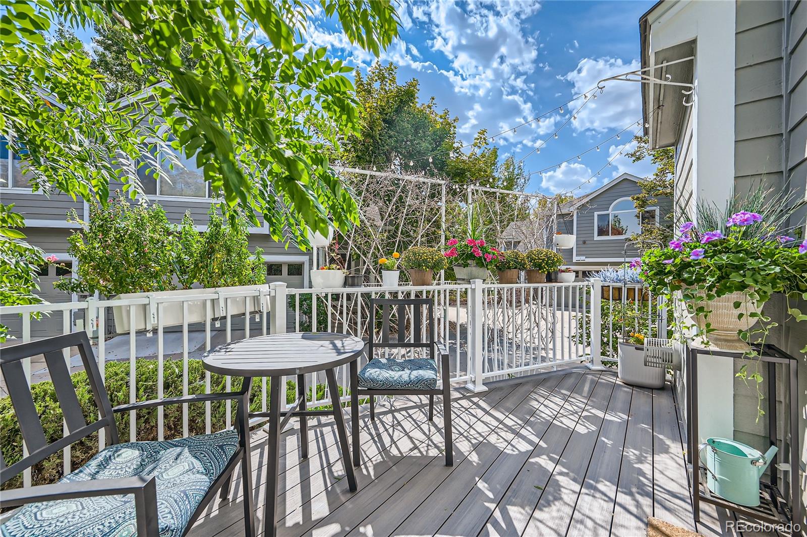 a view of a chair and table in backyard