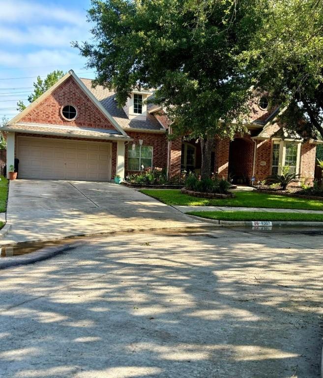 a house that has a tree in front of it