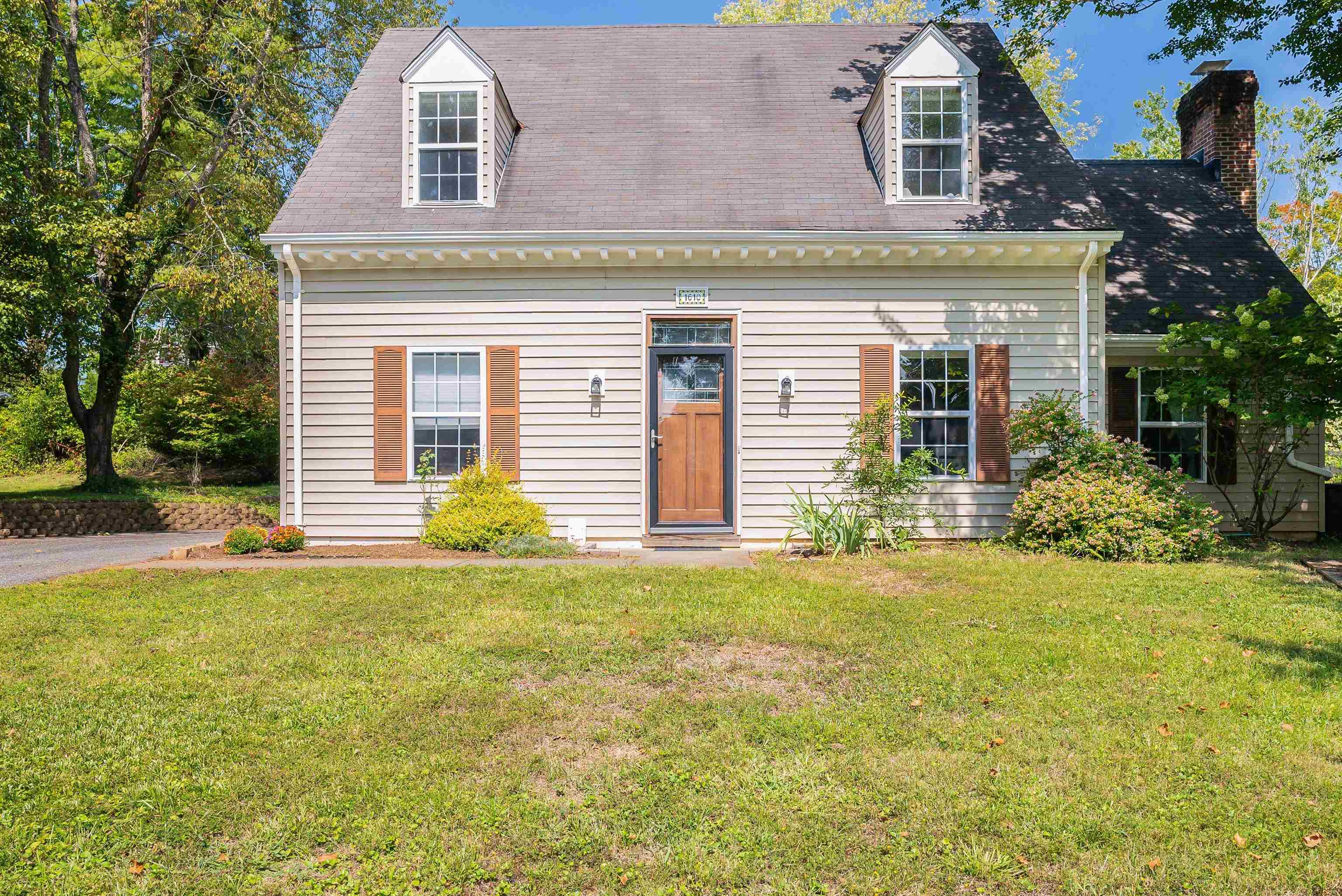 front view of a house with a yard