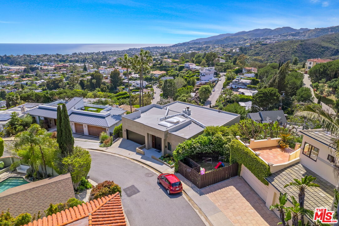 an aerial view of a house with a garden