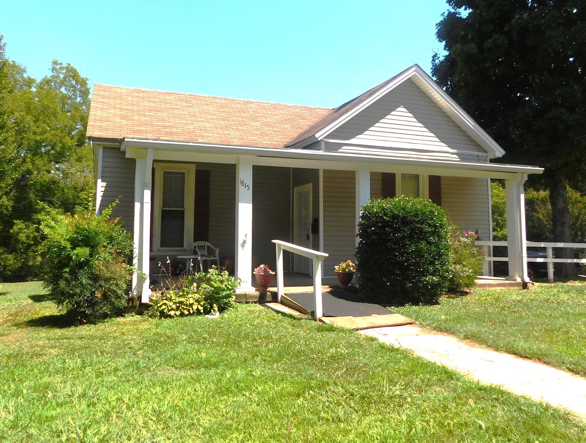 front view of a house with a yard