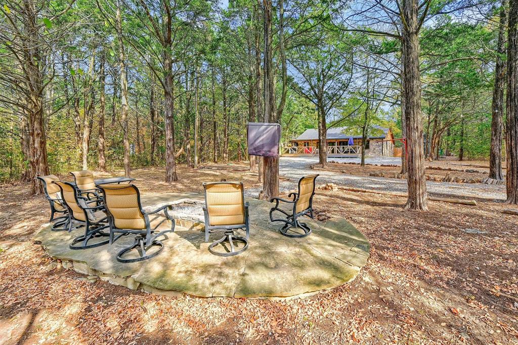 a view of a backyard with sitting area