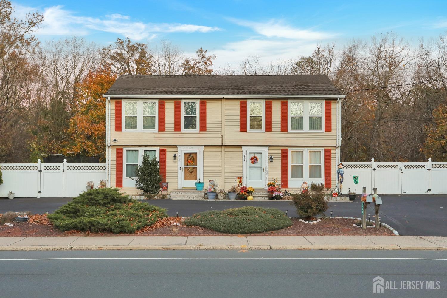 a front view of residential houses with yard