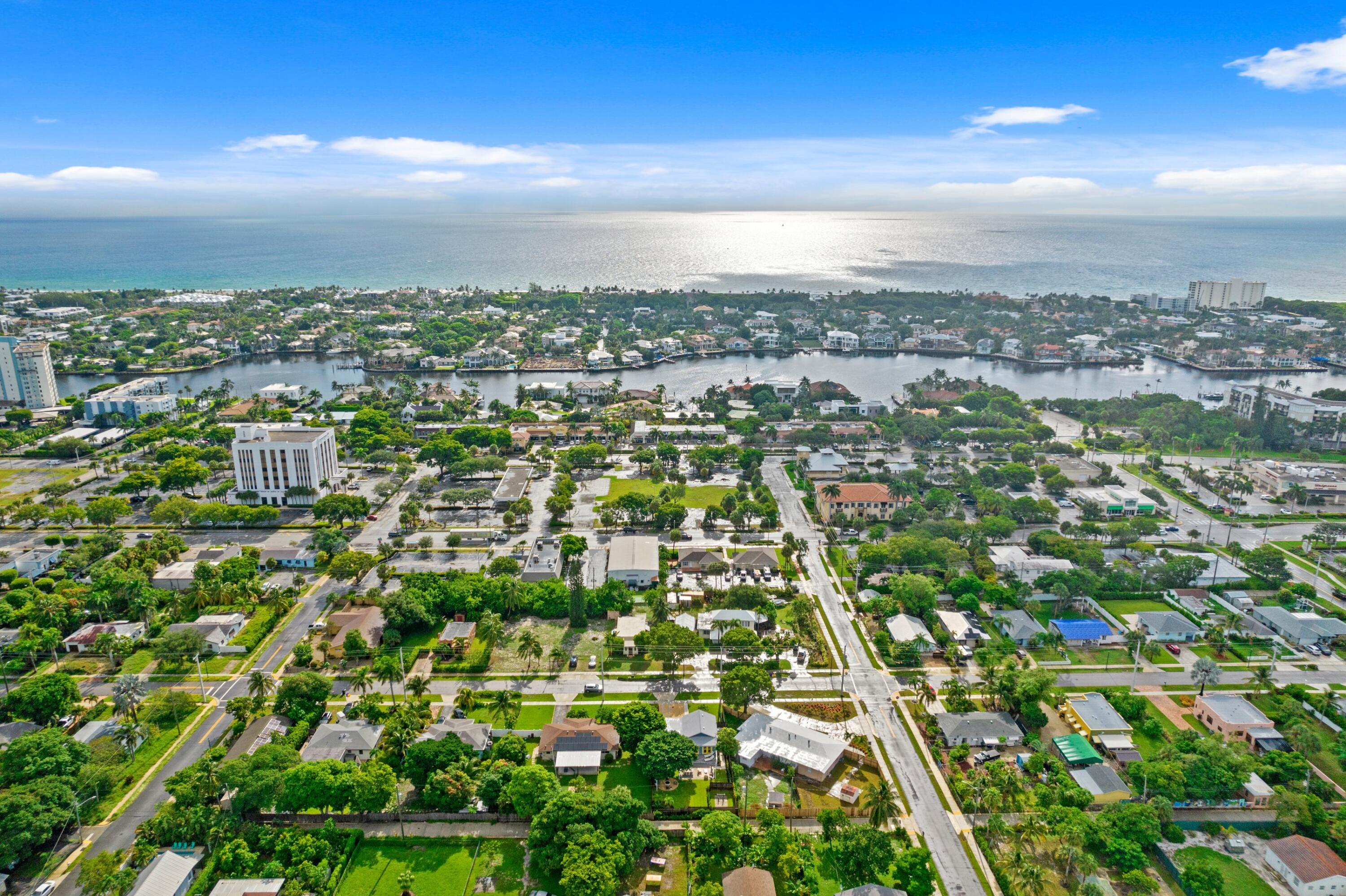 an aerial view of residential houses with city view