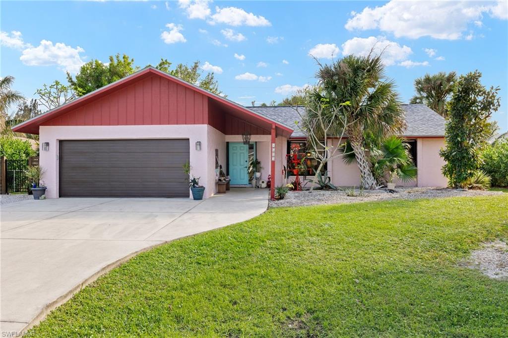 a view of a house with a yard