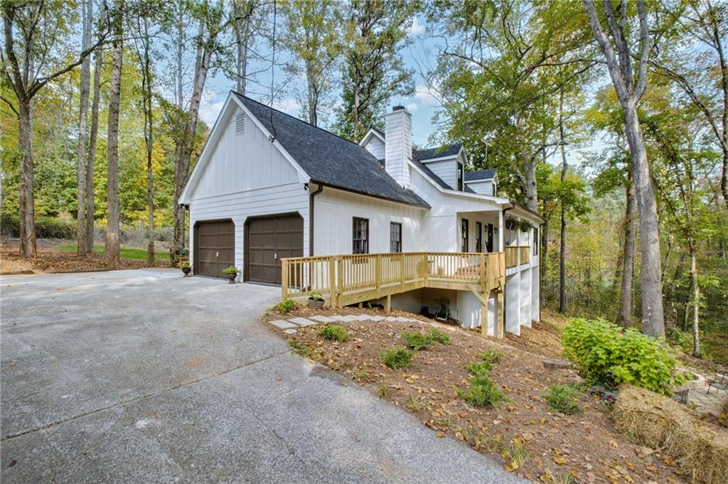 a front view of a house with a yard and outdoor seating