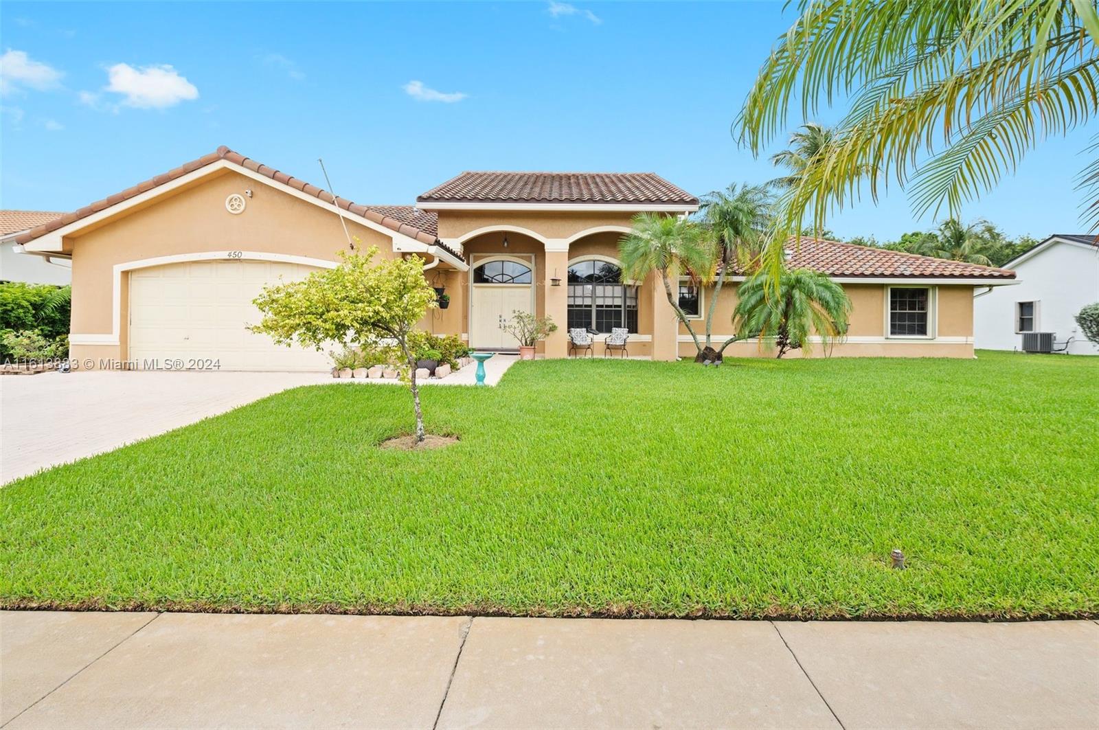 a view of a house with a backyard