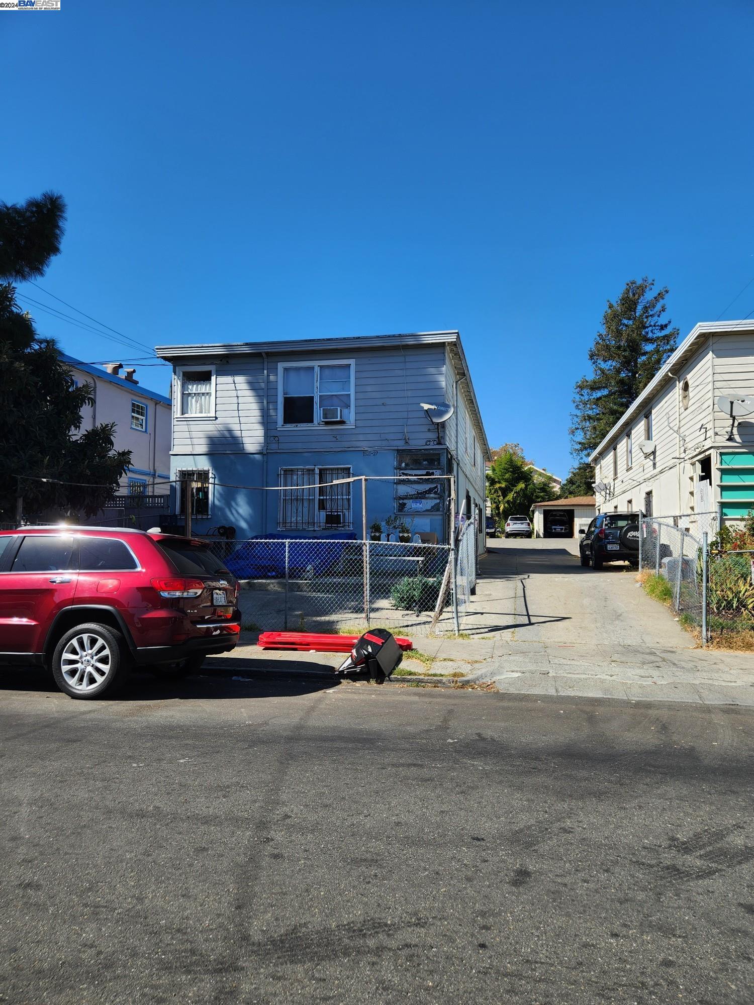 a view of a car in front of a building