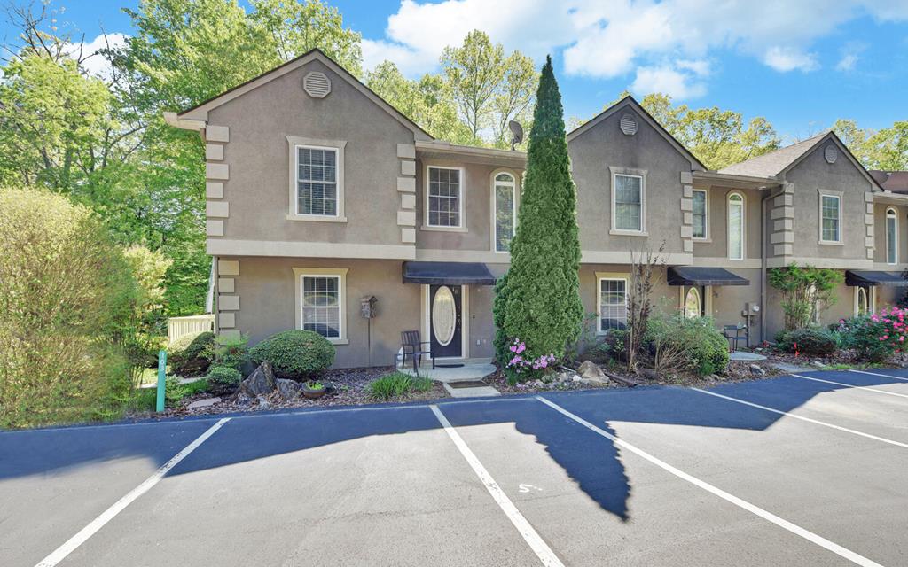 a front view of a house with yard