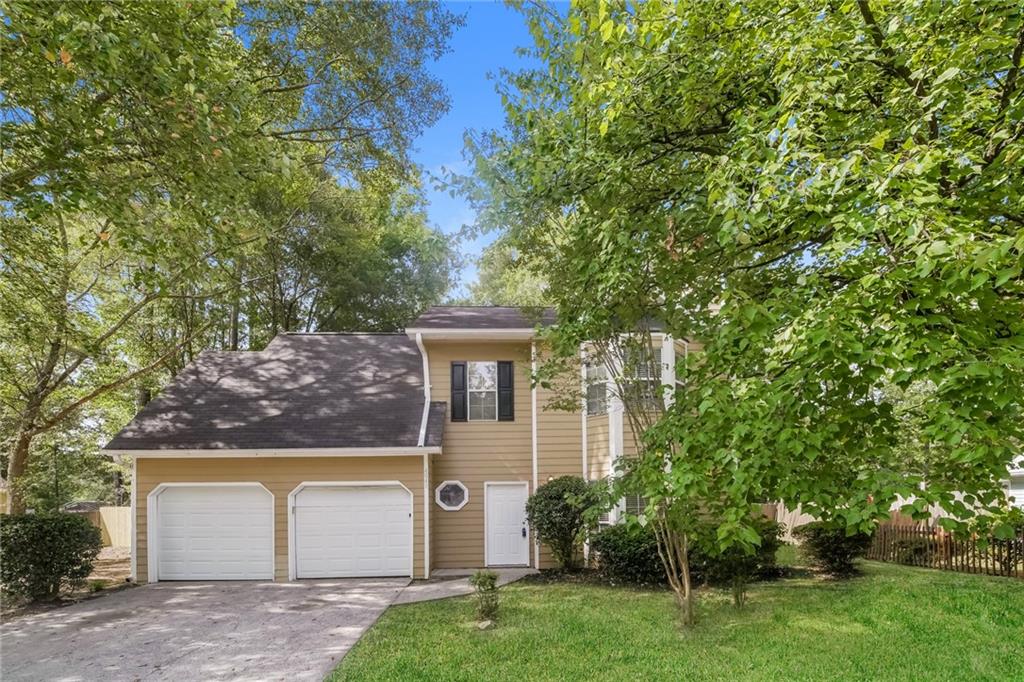 front view of a house with a yard