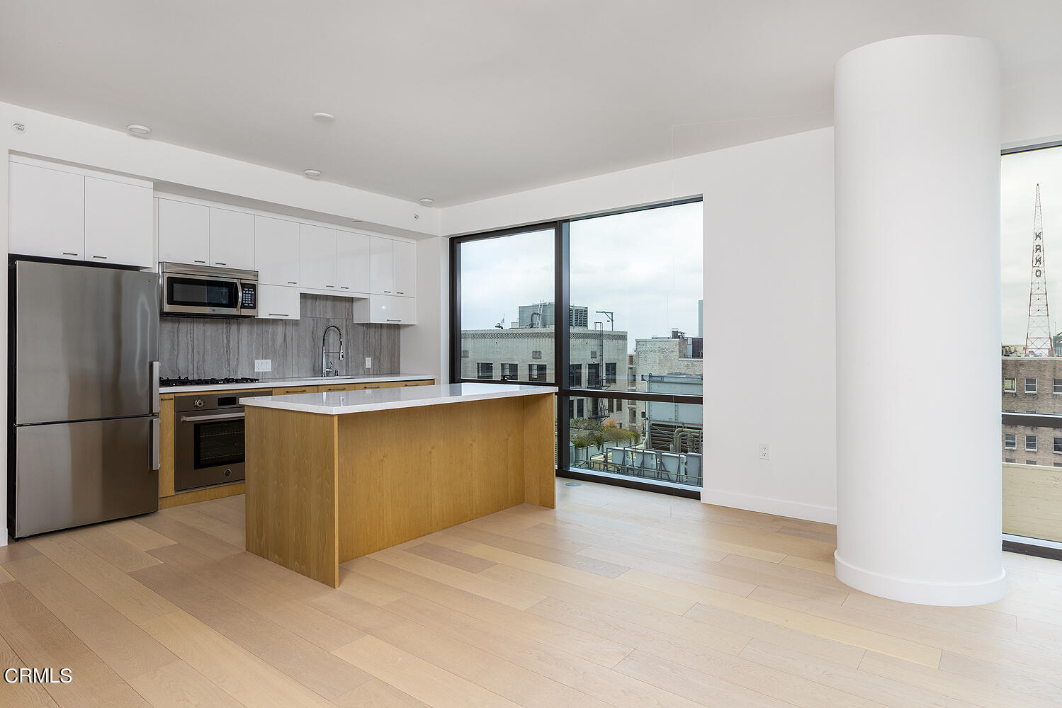 a kitchen with stainless steel appliances a refrigerator and a sink