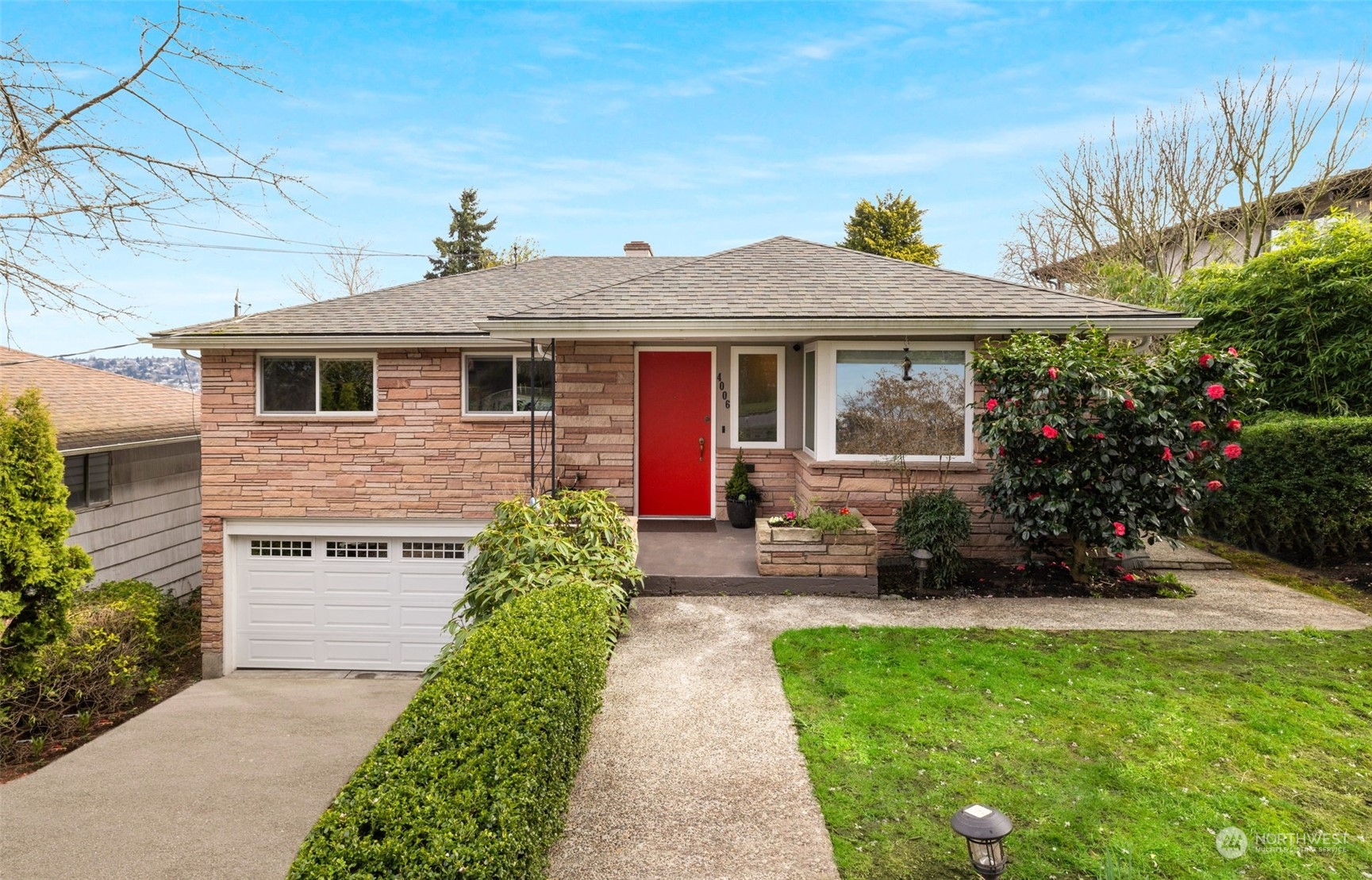 front view of a house with a yard