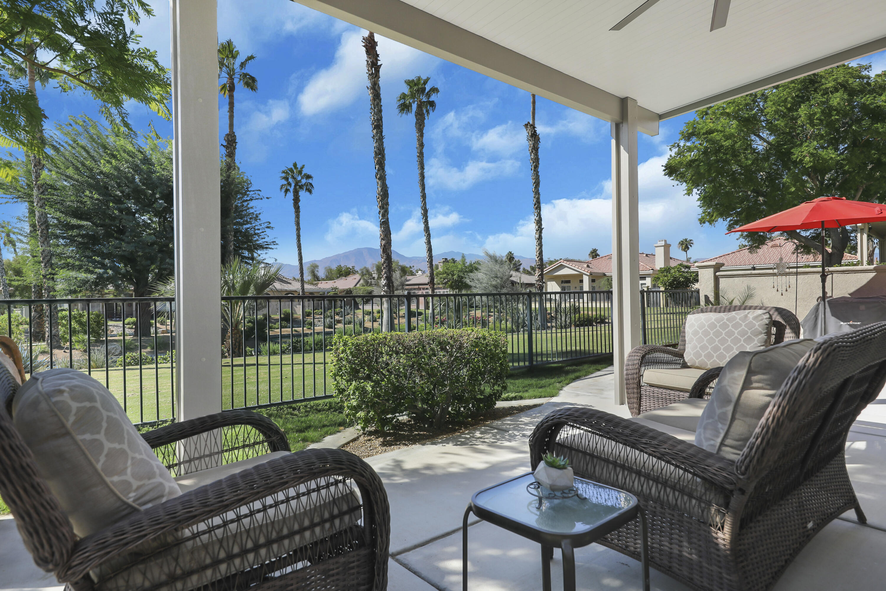 a view of a patio with couches chairs and a table and chairs