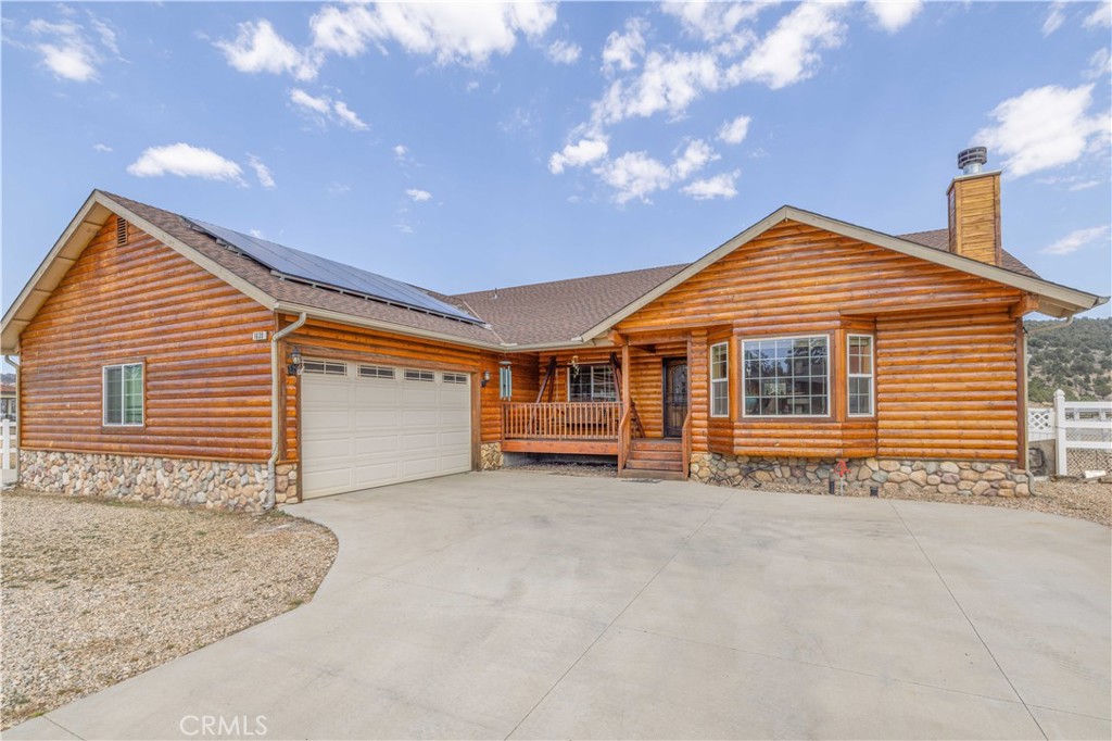 a front view of a house with a garage