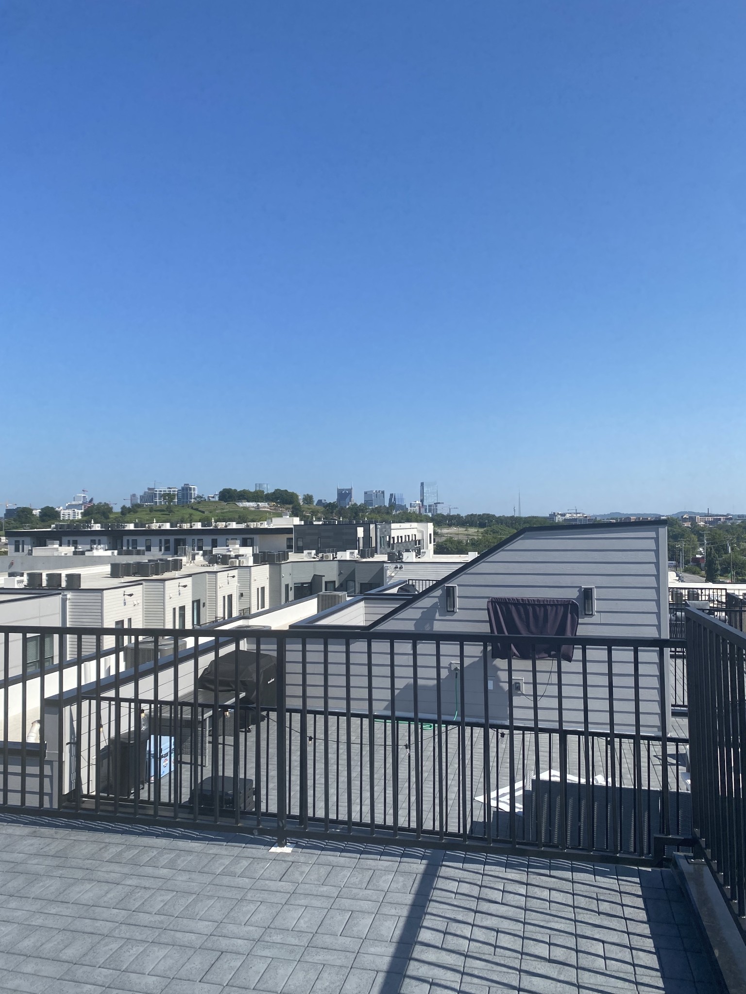 a view of a balcony with city